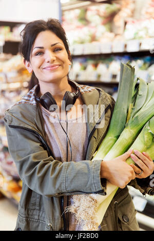 Smiling woman doing shopping Stock Photo