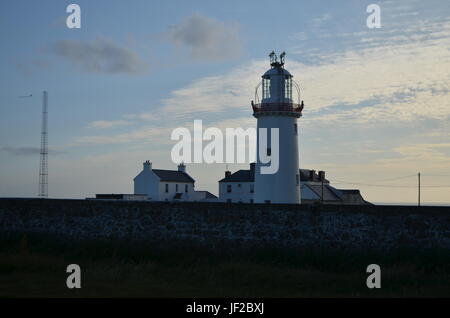 Loop Head Lighthouse and Lightkeeper’s House in Clare, Ireland Stock Photo