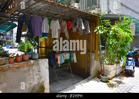 Some clothing being hung out to dry after being hand washed. This old fashioned way is very popular in Taiwan to save money. Stock Photo