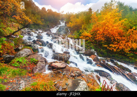 beautiful cascade waterfall in autumn forest Stock Photo