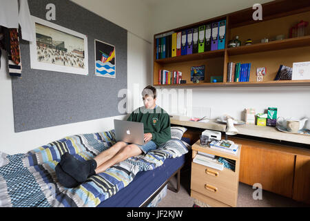 Cambridge University student studying on laptop computer in University accommodation, Queens College Cambridge University, Cambridge England UK Stock Photo