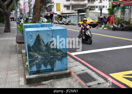 Taiwan electric company paints the power boxes along the street with different scenes on every box, from mountains to flowers. Stock Photo
