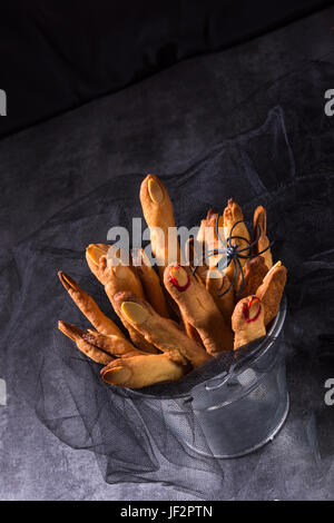 Halloween biscuit finger and cake coffin Stock Photo