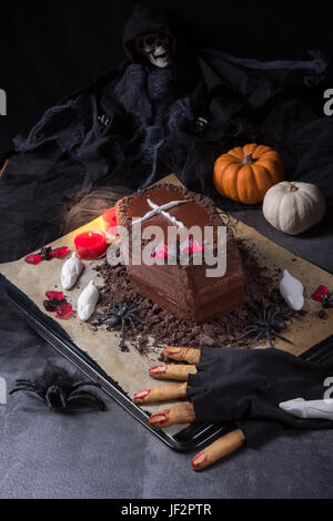 Halloween biscuit finger and cake coffin Stock Photo