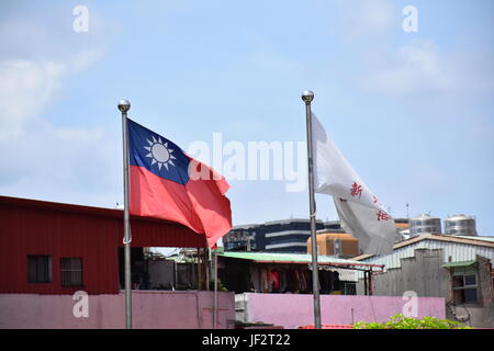 Taiwan flag waving in the wind on a pole in New Taipei City, Taiwan symbol of our love for our country. Stock Photo