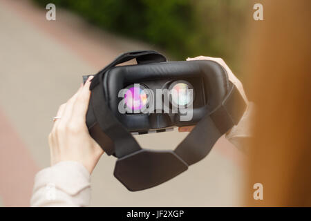 Modern technology vr headset in woman hands. Stock Photo