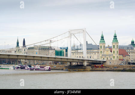 BUDAPEST, HUNGARY - FEBRUARY 21, 2016: Inner City Parish Church and Elizabeth Bridge by the Danube river in Budapest, Hungary. Stock Photo