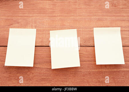 Three stickers on wood background Stock Photo