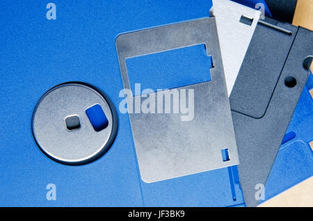 Close up (macro) of a pile of old three and a quarter inch floppy disks to illustrate media storage and/or old technologies. Stock Photo