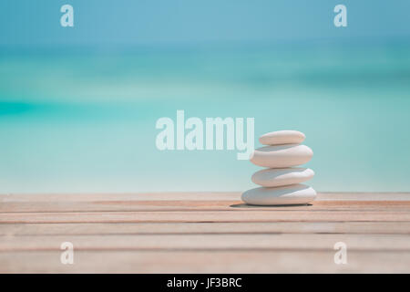 Peaceful zen stones and soft sand for tranquility and meditation and inspiration background concept design Stock Photo
