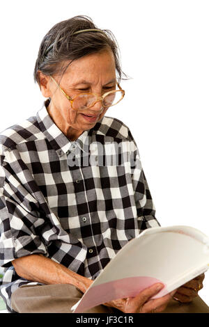 senior woman 70s years old reading book  with relaxing emotion Stock Photo