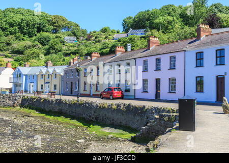 Painted cottages along the harbour, Lower Fishguard, Pembrokeshire, Wales, UK Stock Photo