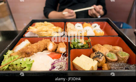women eating  bento box set in japanese restaurant Stock Photo