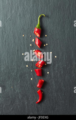 Red chili pepper cut into slices Stock Photo