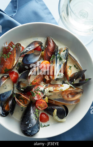 Steamed mussels in white wine sauce Stock Photo