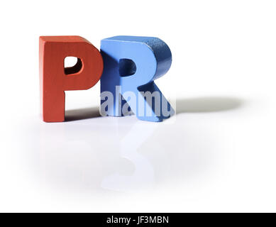 Multicolored word PR made of wood. Stock Photo