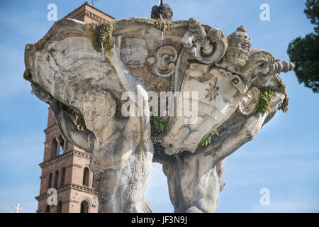 Tritons fountain and Basilica of Saint Mary in Cosmedin (Santa Maria in Cosmedin) at Piazza Bocca della Verita in Rome, Italy Stock Photo