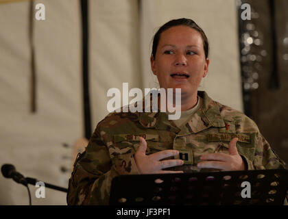 Capt. Sarah Ditto, 435th Air Expeditionary Wing head chaplain, delivers a message during a chapel service at Nigerien Air Base 201, Niger, May 14, 2017. The 435th AEW chapel team, consisting of only two people, covers religious accommodations and spiritual resiliency for deployed Airmen across two continents. (U.S. Air Force photo by Senior Airman Jimmie D. Pike) Stock Photo