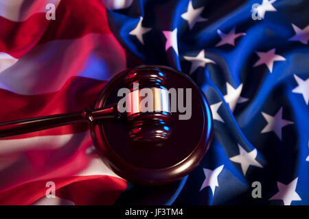 American law concept. Gavel of the judge and american flag. Books, american legal code, constitution. Stock Photo