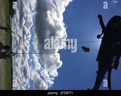 Students attending the U.S. Army Maneuver Center of Excellence Rappel Master Course rappel from a UH-60 Blackhawk helicopter at the Oklahoma National Guard’s Camp Gruber Training Center, May 24, 2017, during their final day of testing to qualify as a Rappel Master.  (U.S. Army National Guard photo by Capt. Jeffrey C. Strow) Stock Photo