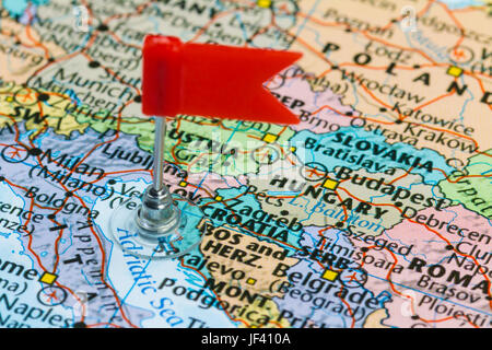 Photo of Croatia marked by red flag in holder. Country on European continent. Stock Photo