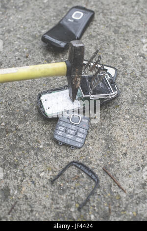 Old broken mobile phone Stock Photo