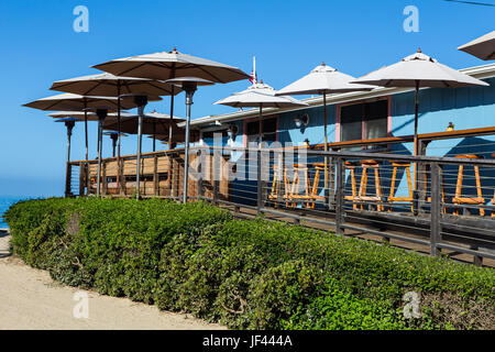 umbrellas on the wood deck of  Beachcomber Restaurant at Crystal Cove State Park California USA Stock Photo