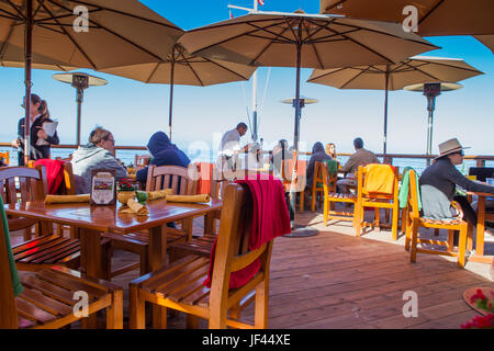 Diners eating outdoors at The Beachcomber Restaurant at Crystal Cove State Park California USA Stock Photo