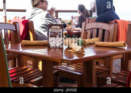 Diners eating outdoors at The Beachcomber Restaurant at Crystal Cove State Park California USA Stock Photo