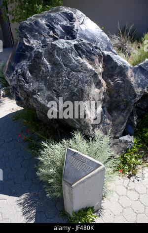 Obsidian rock at the Mono Basin visitors center. Mono county Ca.Obsidian is a naturally occurring volcanic glass formed as an extrusive igneous rock. Stock Photo