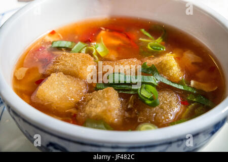 Bowl with a Chinese soup. Stock Photo