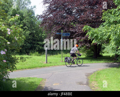 Forth and Clyde canal Glasgow Scotland cyclist on bike on the tow path cycling Scotland Stock Photo