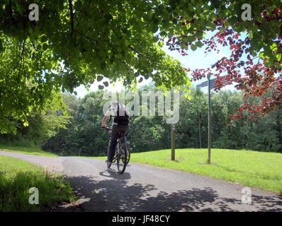 Forth and Clyde canal Glasgow Scotland cyclist on bike on the tow path cycling Scotland Stock Photo