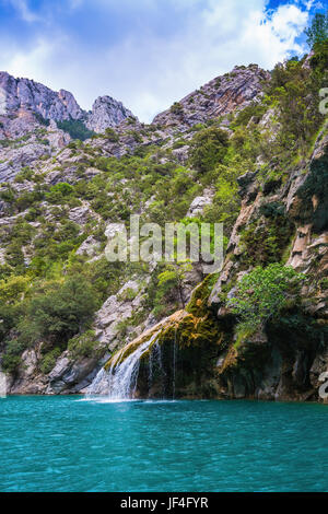 Waterfall on a green mountain at french island Reunion in the indian ...