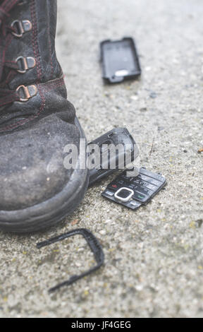 Old broken mobile phone Stock Photo