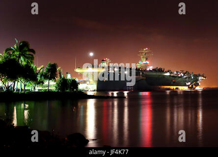 The Nimitz-class aircraft carrier USS John C. Stennis (CVN 74) sits pier side in Pearl Harbor, Hawaii. U.S. Navy photo by Photographer's Mate 3rd Class Mark J. Rebilas. Stock Photo