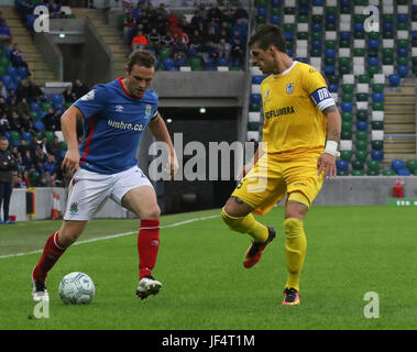 Windsor Park, Belfast, Northern Ireland. 28th June 2017. Linfield (Blue) 1 La Fiorita (Yellow) 0.  Linfield's captain Jamie Mulgrew (left) with La Fiorita captain Danilo Ezequiel Rinaldi. Credit David Hunter/Alamy Live News. Stock Photo