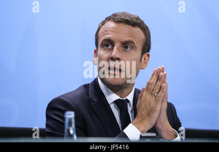 Berlin, Germany. 29th June, 2017. French President Emmanuel Macron attends a press conference after the preparation meeting for G20 at German Chancellery in Berlin, capital of Germany, on June 29, 2017. Credit: Shan Yuqi/Xinhua/Alamy Live News Stock Photo
