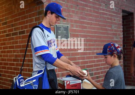 May 16, 2017 - Williamston, NC, USA - Whiteville's Mackenzie Gore signs a basball for Riverside High School fan Easton Warren after the Wolfpack defeated Williamston during the NCHSAA 1A playoff game in Williamston, N.C. Wednesday, May 16, 2017. (Credit Image: © Chuck Liddy/News Observer via ZUMA Wire) Stock Photo
