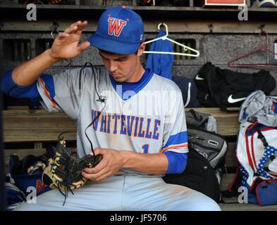 May 16, 2017 - Williamston, NC, USA - Mackenzie Gore repairs a first basemen's glove with a shoelace from his sneakers before taking the bag in action against the Riverside Knights in Williamston, N.C. Wednesday, May 16, 2017. (Credit Image: © Chuck Liddy/News Observer via ZUMA Wire) Stock Photo