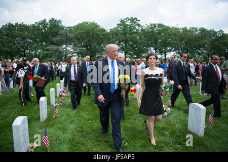 President Donald J. Trump talks with Ms. Katharine Kelley, superintendent, Arlington National Cemetery, in Section 60 of Arlington National Cemetery, Arlington, Va., May 29, 2017.  Trump earlier laid a wreath at the Tomb of the Unknown Soldier and spoke at the Memorial Ampitheater.  (U.S. Army photo by Elizabeth Fraser / Arlington National Cemetery / released) Stock Photo