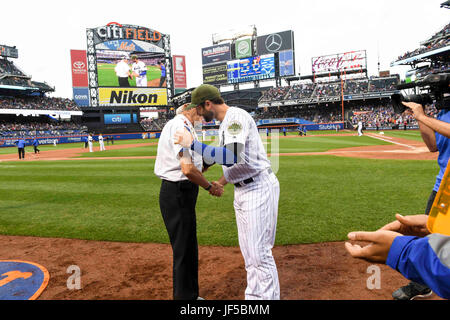 170529-N-TK177-221 NEW YORK (May 29, 2017) New York Mets second baseman Neil Walker shakes hands with veteran of the game George E. Parsons, retired U.S. Army National Guard, during the annual USO/Mets Military Appreciation Game at Citi Field as part of 2017 Fleet Week New York (FWNY), May 29. FWNY, now in its 29th year, is the city’s time honored celebration of the sea services. It is an unparalleled opportunity for the citizens of New York and the surrounding tri-state area to meet Sailors, Marines and Coast Guardsmen, as well as witness firsthand the latest capabilities of today’s maritime  Stock Photo