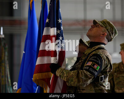 Bagram Honor Guard members set the American and U.S. Air Force flag during a change of command ceremony at Bagram Airfield, Afghanistan, June 3, 2017. During the ceremony, Brig. Gen. Jim Sears relinquished command of the 455th Air Expeditionary Wing to Brig. Gen. Craig Baker. (U.S. Air Force photo by Staff Sgt. Benjamin Gonsier)