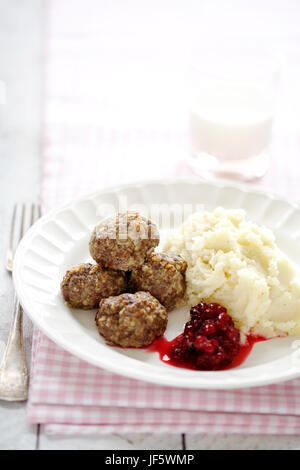 Meatballs with mashed potatoes and cranberry sauce Stock Photo