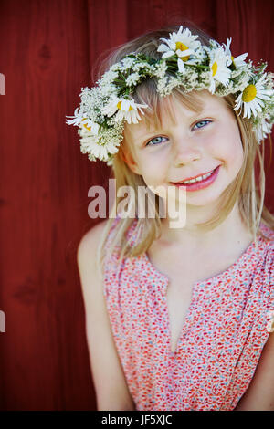 Portrait of girl wearing flower wreath Stock Photo - Alamy
