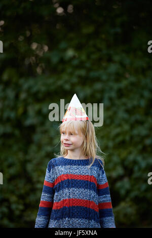 Girl wearing party hat Stock Photo