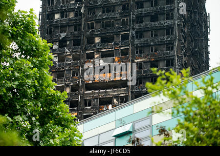 The burnt remains & devastation caused by fire, which ripped through the Grenfell Tower block leaving hundreds homeless and many dead or missing. Stock Photo