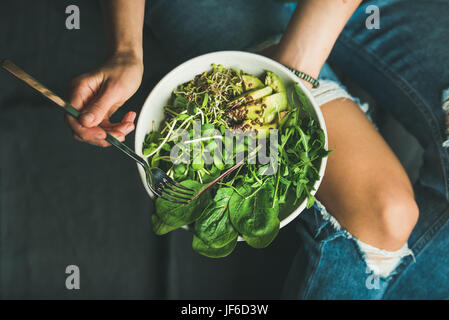 Clean eating breakfast with spinach, arugula, avocado, seeds and sprouts Stock Photo
