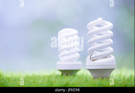 Energy saving bulbs in the grass Stock Photo