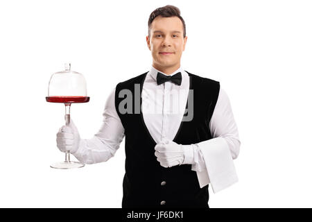 Waiter holding a cake server stand isolated on white background Stock Photo